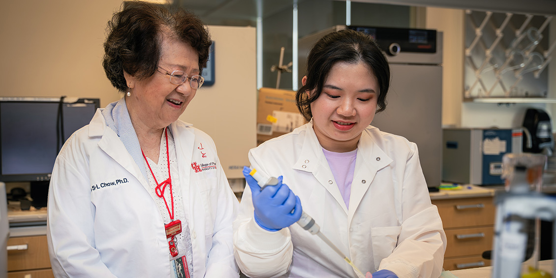 Ph.D. student Liao with Professor Chow in the lab